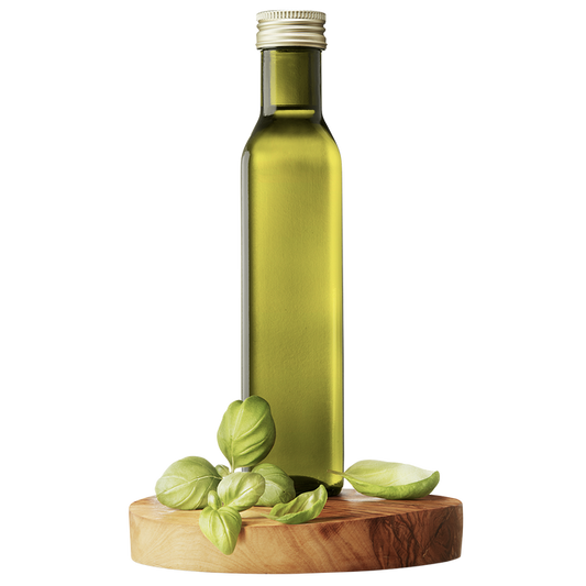 A bottle of extra virgin olive oil with fresh basil leaves next to it, all presented on a wooden platform.