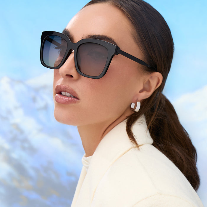 on model - female wearing diff eyewear featuring the bella square sunglasses with a black acetate frame and twilight gradient polarized lenses angled view