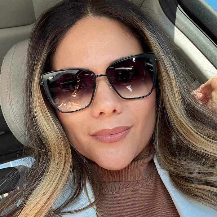customer content - female wearing grace cat eye sunglasses with a black frame and grey gradient sharp lenses