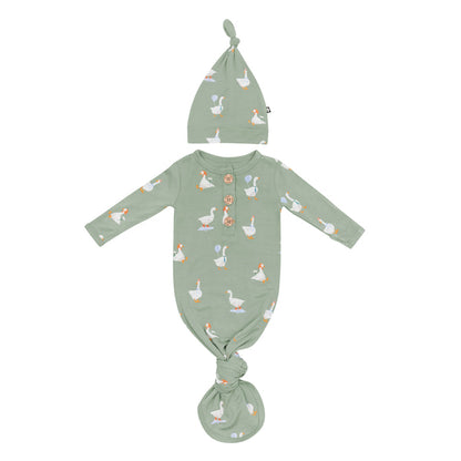 Product photo of the Knotted Gown with Hat Set in Silly Goose showing the knotted gown tied at the bottom and arms out