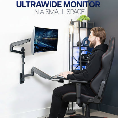 Person using an ultrawide monitor setup with adjustable arms and an adjustable keyboard tray in a modern room.