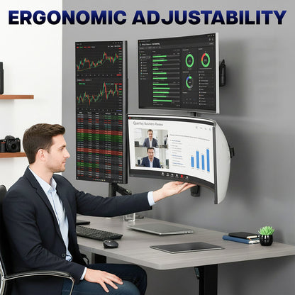 Man in a suit sitting at a desk with multiple monitors, emphasizing ergonomic adjustability.