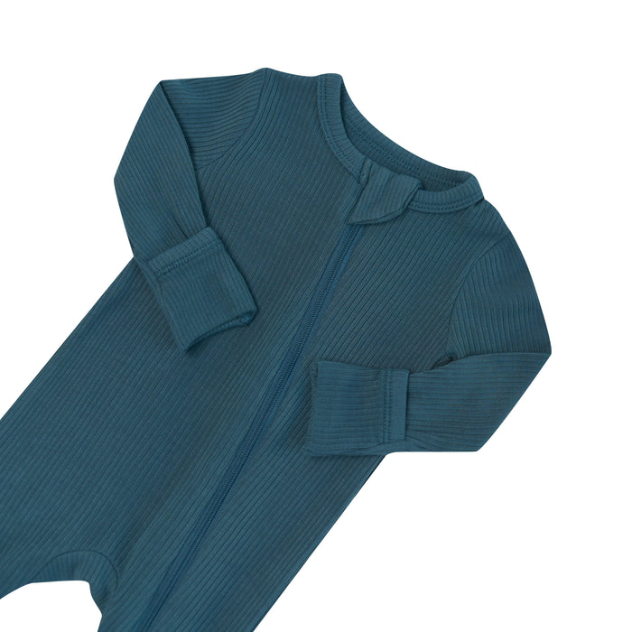 Close up of the zipper garage and fold over hand cuffs on the Ribbed Zipper Romper in Atlantic