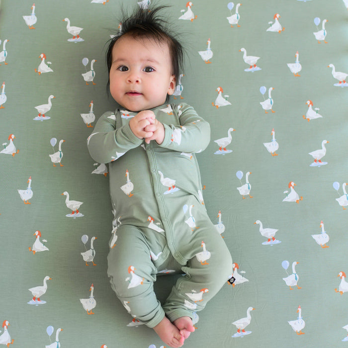 Baby wearing silly goose romper pajamas with snaps