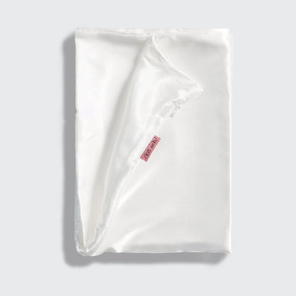KITSCH Ivory Standard Satin Pillowcase — styled bedroom scene