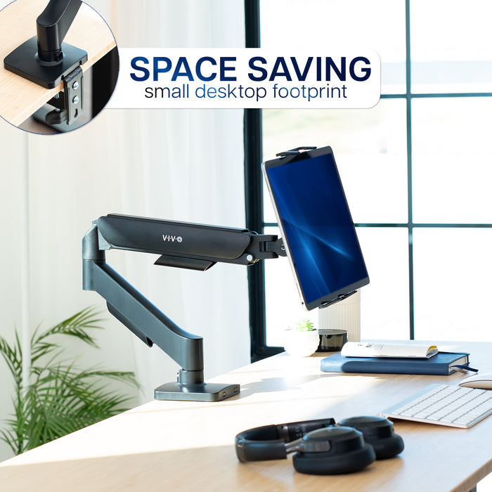 Space-saving portable monitor or tablet stand on a desk with a computer screen, keyboard, and mouse.